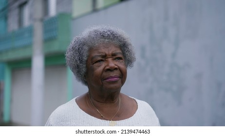 A Senior Black Woman Walking Forward In Urban Street