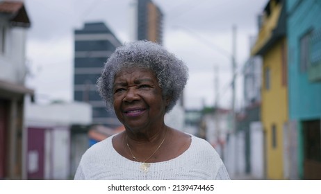 A Senior Black Woman Walking Forward In Urban Street