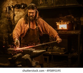 Senior Blacksmith Forging Molten Metal On Stock Photo 495895195 ...