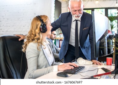 Senior Boss Talking With His Employee In Office