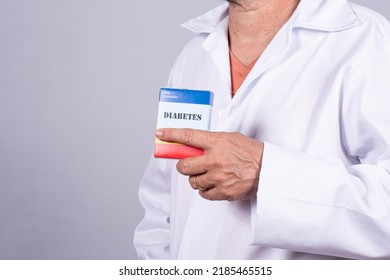 Senior Brazilian Doctor In White Coat, No Face, Holding Medicine Box