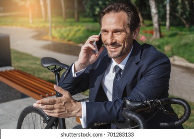 Senior Business Man With A Bicycle Outdoors