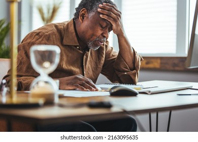 Senior Business Man Concerned Thinking About Online Problem. Frustrated Worried Senior Middle Aged Male Suffering From Memory Loss, Having A Headache.