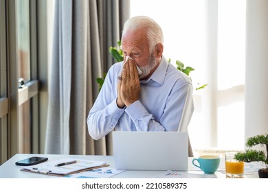 Senior Business Man Feeling Sick With Cold And Fever At Office, Ill With Flu Sitting At His Desk