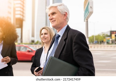 Senior Business Man Leaving Work With Colleagues, Business People Standing Outdoor And Discussing