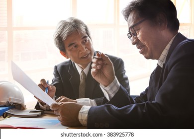 Senior Business Man In Meeting Room