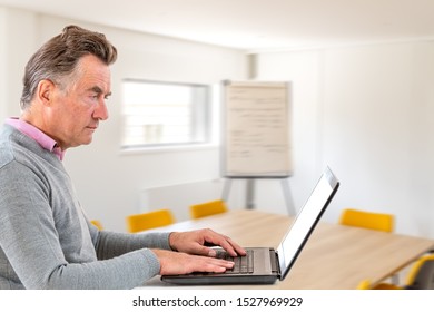 Senior Business Man Seek Tranquility To Work-Pensive Businessman Working With A Laptop In Confrence Room