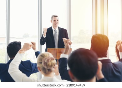 Senior business man talking at podium speaker. Business people meeting at business conference room - Powered by Shutterstock