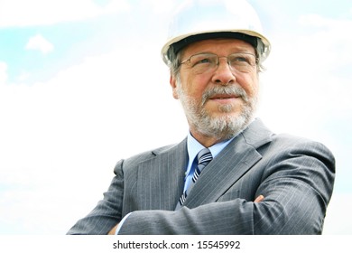 Senior Business Man With White Hard Hat