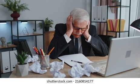 Senior Business Office Man Use Laptop Throwing Crumpled Paper, Having Nervous Breakdown At Work, Migaine, Headache, Stress Management, Mental Distress Problems, Losing Temper, Reaction On Failure