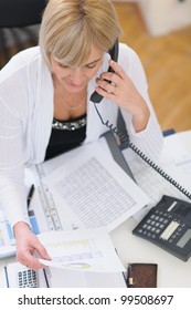 Senior Business Woman Making Phone Call. Top View