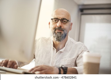 Senior Businessman Working On Computer