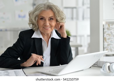 Senior businesswoman with laptop