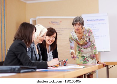 senior businesswoman in a meeting with colleagues