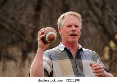 Senior Caucasian Male Throwing Football