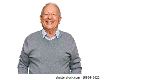 Senior caucasian man wearing casual clothes looking positive and happy standing and smiling with a confident smile showing teeth  - Shutterstock ID 1898448622