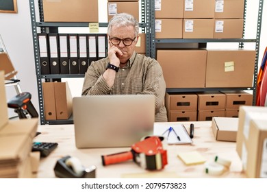 Senior Caucasian Man Working At Small Business Ecommerce With Laptop Thinking Looking Tired And Bored With Depression Problems With Crossed Arms. 