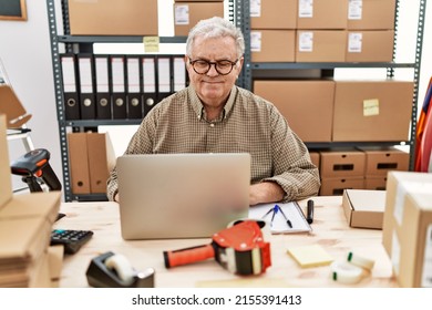 Senior Caucasian Man Working At Small Business Ecommerce With Laptop With A Happy And Cool Smile On Face. Lucky Person. 