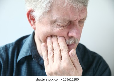 Senior With Cheek Soreness Or Tooth Pain