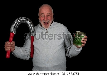 A senior citizen casually bends a large spring expander with one hand while holding a can of spinach, his secret weapon for strength, in the other.
