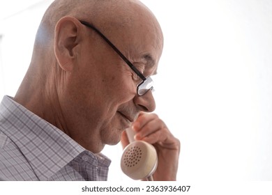 Senior citizen on vintage phone call, hand removing Handset, white Rotary Telephone with Disc Dial with finger, putting retro phone reciver down, hanging up, calls helpline, psychological support