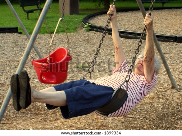 Senior Citizen Woman On Swing Playground Stock Photo 1899334 | Shutterstock