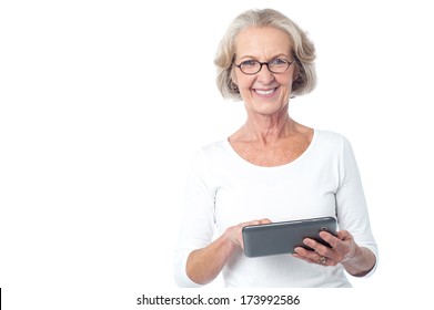 Senior Citizen Working On New Tablet Pc