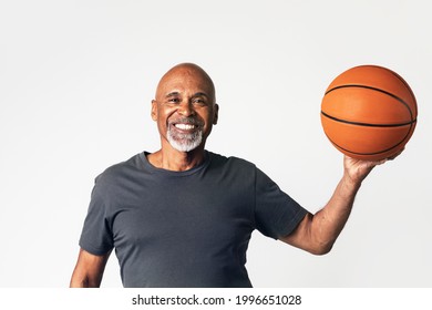 Senior Coach Holding A Basketball