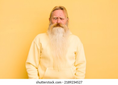 Senior Cool Bearded Man Looking Goofy And Funny With A Silly Cross-eyed Expression, Joking And Fooling Around