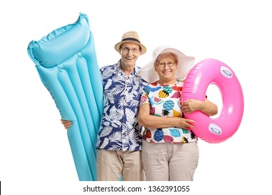 Senior Couple With An Air Mattress And A Swimming Tire Isolated On White Background