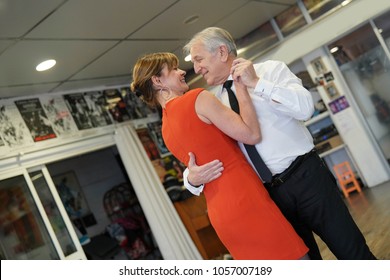 Senior couple attending dance class - Powered by Shutterstock