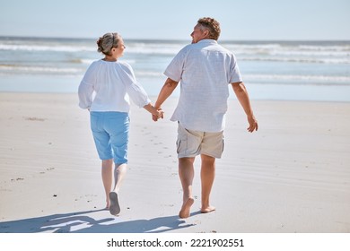 Senior couple, beach and retirement vacation walking, talking and happy about fitness, summer and travel together. Man and woman show happiness, love and marriage support on nature holiday by water - Powered by Shutterstock