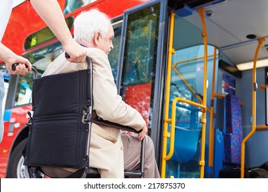 Senior Couple Boarding Bus Using Wheelchair Access Ramp