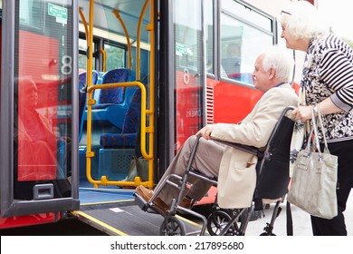 Senior Couple Boarding Bus Using Wheelchair Access Ramp