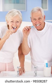 Senior Couple Brushing Teeth