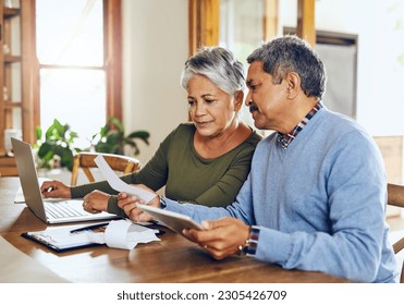 Senior couple, budget planning and health insurance checklist with computer at home. Documents, pension and elderly people with financial, tax and debt form in a house with bills and pc admin - Powered by Shutterstock