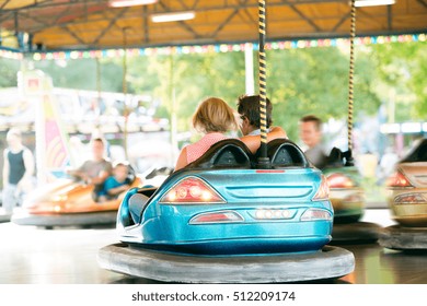 Senior Couple In The Bumper Car At The Fun Fair