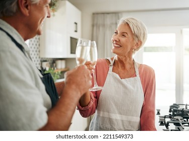 Senior Couple, Champagne And Drinks Toast In House Or Home Kitchen In Marriage Anniversary, Celebration Event Or Retirement Security Success. Happy Smile, Love Or Elderly Man, Woman And Alcohol Glass