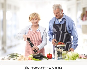 Senior Couple Cooking In The Kitchen.