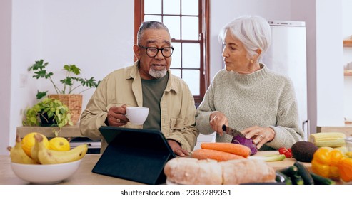 Senior couple, cooking and tablet in kitchen with knife, vegetables and tea cup for conversation. Interracial marriage, elderly woman and old man with touchscreen for app, food or nutrition in home - Powered by Shutterstock