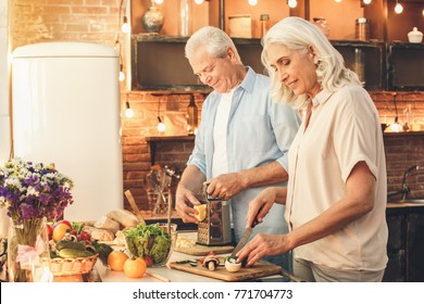 Senior Couple Cooking Together At Home Love