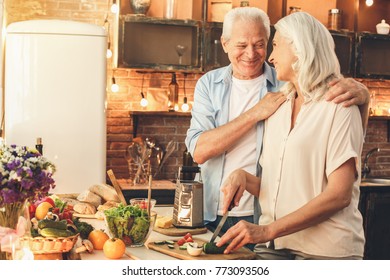 Senior Couple Cooking Together At Home Love