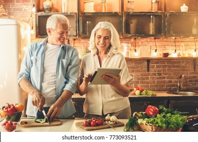 Senior Couple Cooking Together At Home Love