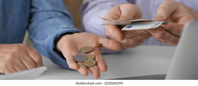 Senior Couple Counting Money At Home, Closeup