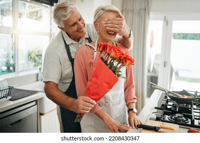 Senior couple, covering eyes and flowers surprise as man give wife bouquet of roses on an anniversary, birthday or valentines day in kitchen. Happy old man and woman being romantic in Australia house - Powered by Shutterstock