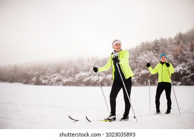 Senior couple cross-country skiing.