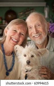 Senior Couple With Cute White Dog