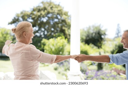 Senior couple dancing on patio - Powered by Shutterstock