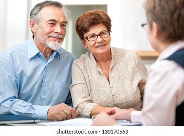 Senior couple discussing financial plan with consultant - Powered by Shutterstock