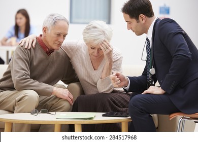 Senior Couple Discussing Test Results With Doctor - Powered by Shutterstock